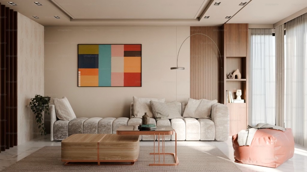Modern living room interior with sofa, artwork, and natural light